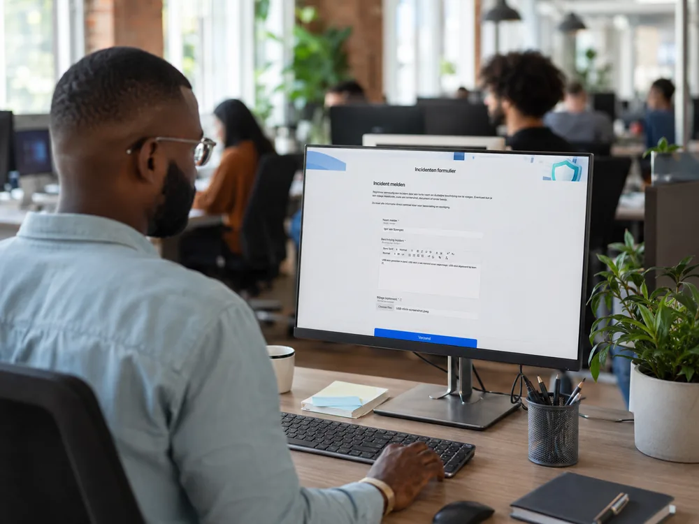 Employee reporting an incident through a form on their screen